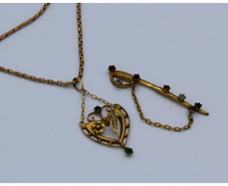 A green paste set Art Nouveau style pendant, stamped H &amp; W 9ct, along with an unmarked yellow metal box chain with barrel