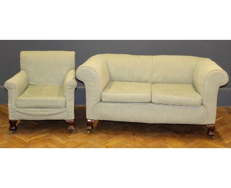 A walnut framed two seater settee upholstered in pale green weave and a pair of matching armchairs, on bracket feet. Width of