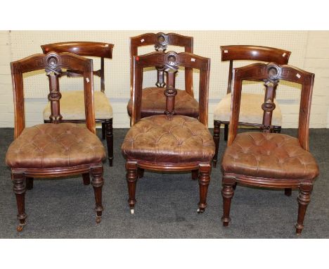 A set of four Edwardian mahogany dining chairs, each with scallop carved and incised rail, pierced vertical splat, button hid