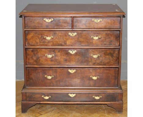 A 19th century Continental walnut chest of two short and three long drawers, over further base drawer on bracket feet. 102 x 