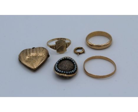 A collection of yellow metal jewellery. Comprising two band rings, unmarked but surface testing for 14k ( total weight 6.2 gr