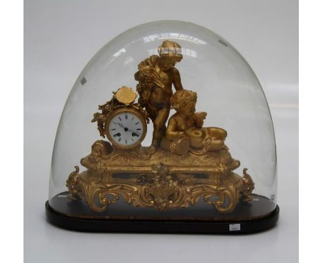 A 19th century French gilded spelter mantle clock, cast with Bacchanalian putti and drum head case enclosing an eight day mov