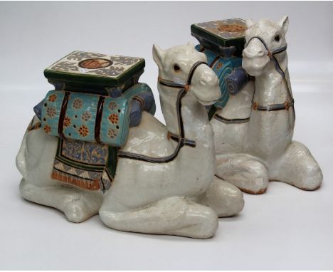 Two 20th century ceramic garden seats, modelled as a recumbent camel. 46 cm high&nbsp;