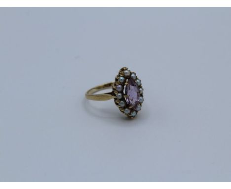 A 9ct gold marquise cut amethyst and pearl set ring. Size K 1/2, 2.7grams approximately&nbsp;