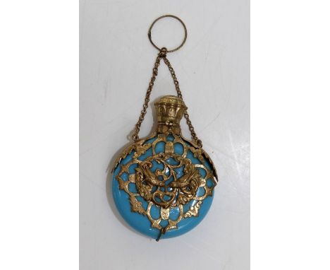 An early 20th century, probably French bleu celeste porcelain and gilt metal overlaid scent bottle of disc form, with love bi