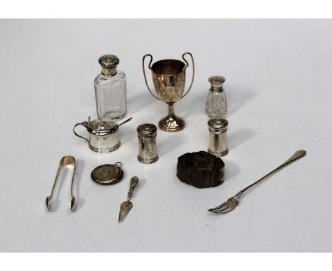 A collection of small silver including condiments, pickle fork, trophy cup, patch box, trowel book mark, scent bottle and oth