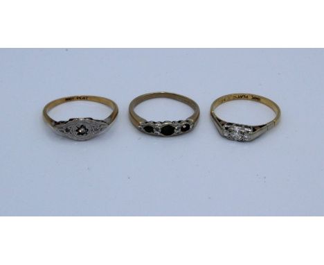 Two early 20th century diamond rings, along with an 18ct emerald and diamond half hoop ring ( one emerald missing). Comprisin