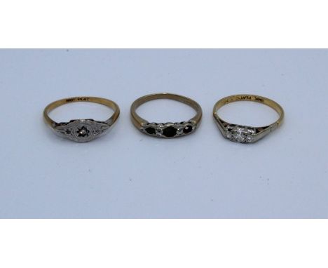 Two early 20th century diamond rings, along with an 18ct emerald and diamond half hoop ring ( one emerald missing). Comprisin