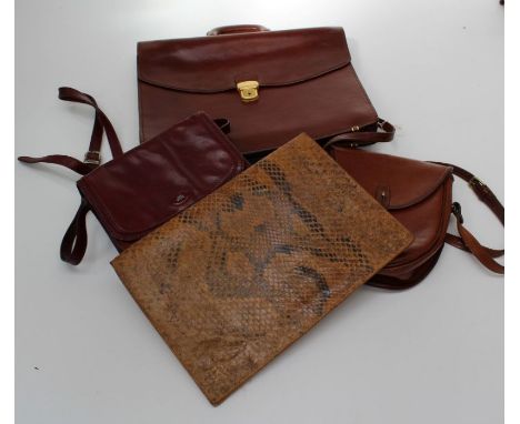 A small collection of four various vintage handbags, a briefcase and a python skin large holdall
