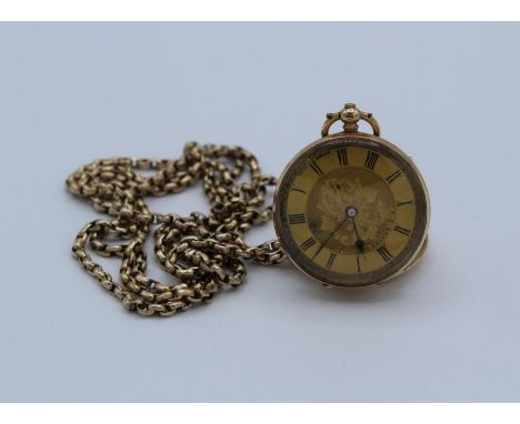 A 14k stamped key winding pocket watch with open dial and yellow metal chain