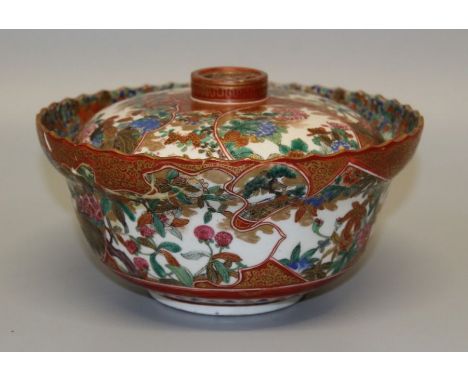 A 19th century Japanese Kutani porcelain bowl and cover with reticulated Mon finial. Richly internally decorated with cranes 