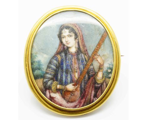 Early gold oval frame brooch on mother of pearl portrait of a maiden mount tested 14ct gold 2.5ins