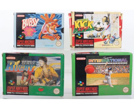  Four Boxed Super Nintendo SNES Games, including, bubsy has inner card and manual, World class Rugby cartridge and manual, Ki