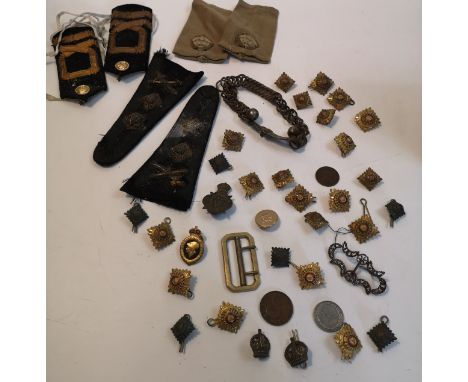 Collection of vintage militaria to include labels military buttons and cap badges.