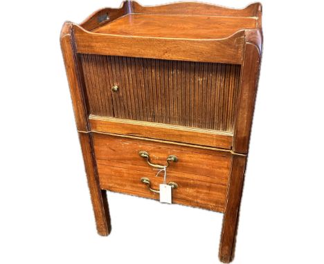 19th century mahogany unit, the top with gallery tray above a tambour front the lower with pull-out commode. [75cm x 49cm x 4