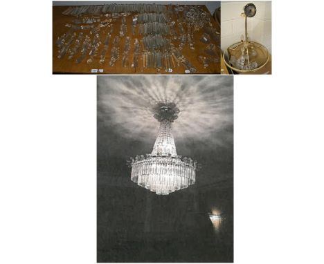 An impressive early 20th century cut glass chandelier of five tier graduated form and suspending drop lustres