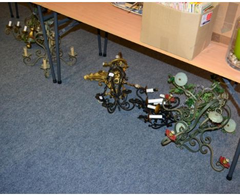 ~ A wrought iron four-branch candle holder; together with a quantity of painted and gilt chandeliers and light fittings (9) 
