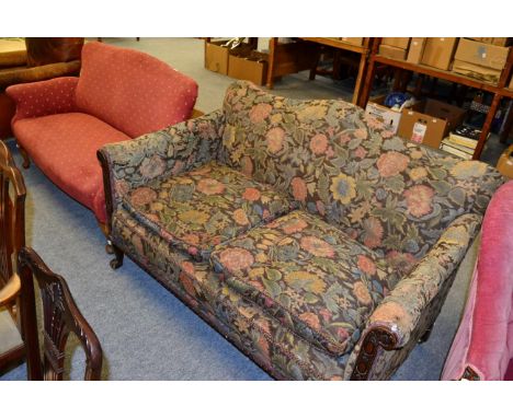 Mahogany framed hump back two seated cottage sofa; together with a similar two seater sofa 