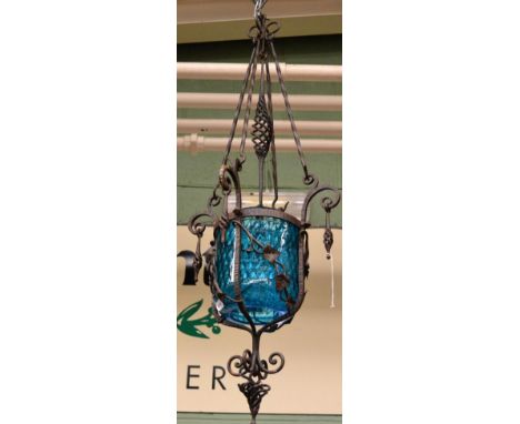 ~ A 20th century wrought iron and blue glass lantern 