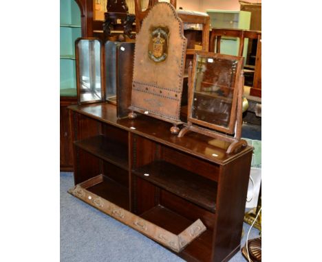 Mahogany low open bookcase; tryptic mirror; toilet mirror; Arts & Crafts copper fire curb; and a tool and studded leather fir