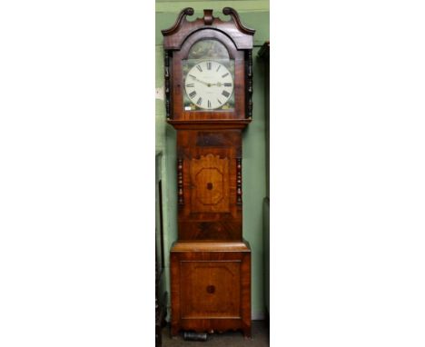 An oak and mahogany thirty hour longcase clock, signed Wm Hargraves, circa 1830, swan neck pediment, trunk door flanked by tu