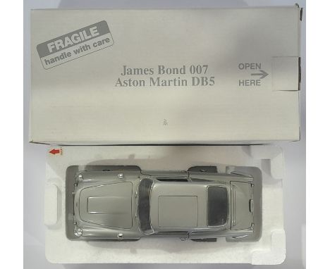 Danbury Mint a boxed 1/24 scale James Bond 007 Aston Martin DB5 (Chrome). Conditions generally appear Near Mint to Mint in ge