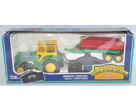 A mixed group of farmyard vehicles including a remote control Tractor with Log-Trailer, 4 Wheeler Bike and others. (See Photo