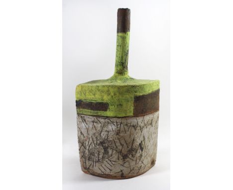 Robin Welch (b.1936-) An unusual Studio Pottery bottle vase with cylindrical neck above oval incised lower body with lime gre