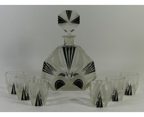 An Art Deco clear and black glass drinking setComprising decanter and stopper, height 25cm, six shot glasses, each having cut