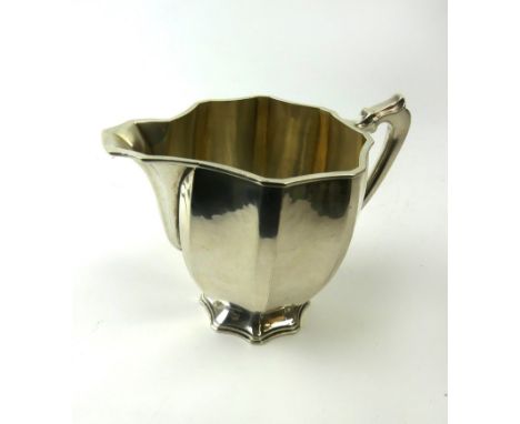 A George VI hallmarked silver cream jugHaving panelled decoration, by R E Stone, London 1939, height 9.5cm, approximate weigh