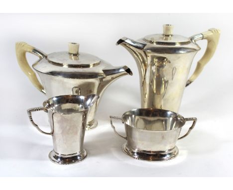 A George VI Art Deco hallmarked silver four piece tea and coffee serviceComprising coffee pot, teapot each with ivory handles