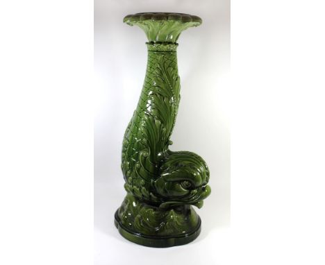 A Burmantofts green glazed ceramic jardiniere standModelled in the form of a dolphin with the tail forming the jardiniere sup