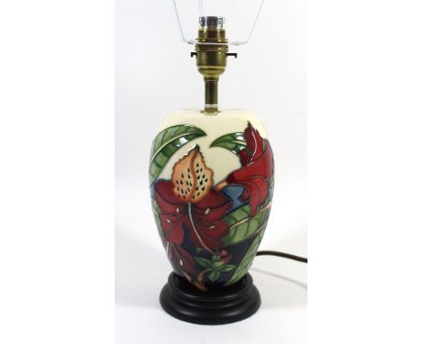 A modern Moorcroft pottery table lampOf ovoid form, decorated in the Simeon pattern, designed by Philip Gibson, raised on woo