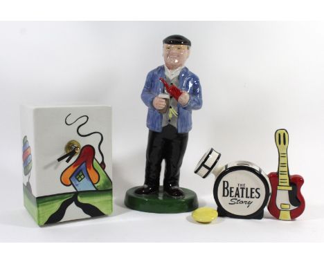 Three pieces of Lorna Bailey ceramicsTo include Fantasia Cottage mantel clock, height 15.5cm, model of Fred Dibnah, height 26