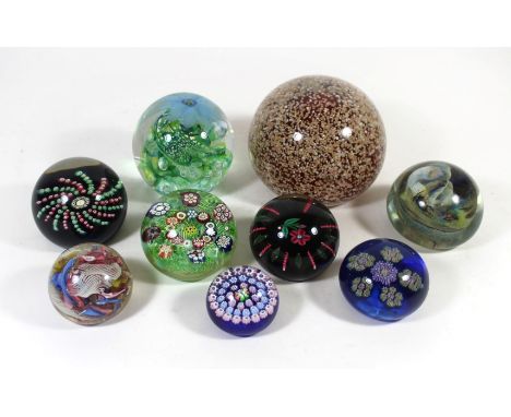 Nine assorted glass paperweightsVarious manufacturers to include Strathearn example with internal mottled decoration, diamete