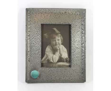 An Arts & Crafts pewter photograph frameOf rectangular form with ceramic cabochon possibly Ruskin, 36.5x30cmCONDITION REPORT: