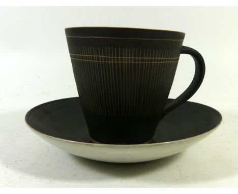 Dame Lucie Rie D.B.E (1902-1995) cup and saucerHaving sgraffito linear decoration, mark to base, height 8cmCONDITION REPORT:C