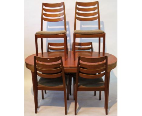 A retro Nathan teak dining suiteComprising oval extending table with extra leaf, length not extended 153, six ladder back cha