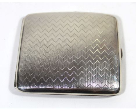 A George V hallmarked silver cigarette case Of curved form, having engine turned Art Deco design, made by Walter Hair Haseler