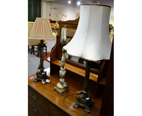 A pair of reproduction table lamps, a twin light standard lamp and another table lamp