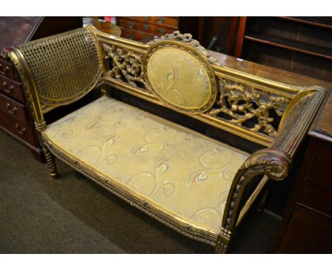 A gilt and bergere sofa 