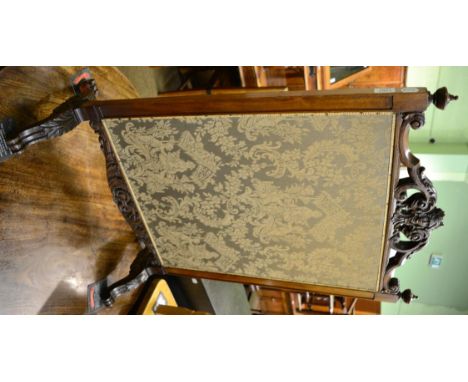 A Victorian carved walnut fabric panel fire screen 