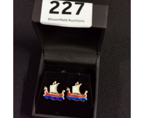 PAIR OF GILDED &amp; ENAMEL CUFFLINKS