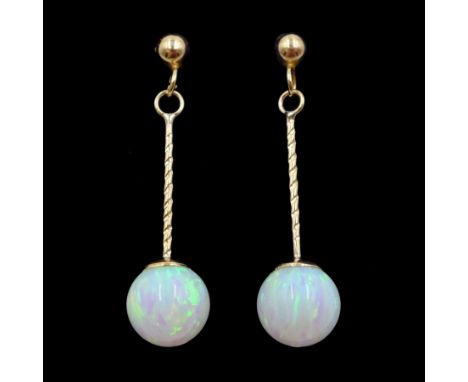 Pair of 9ct gold opal pendant stud earringsCondition Report:Approx 1gm, length = 27mm, good condition