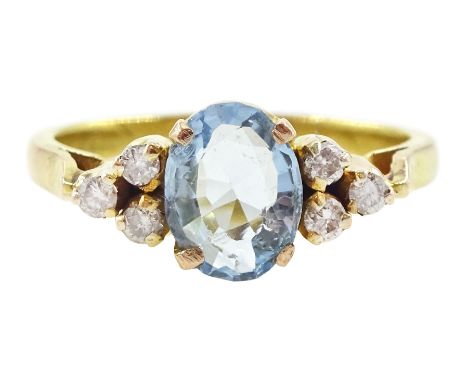 18ct gold oval cut aquamarine and six stone round brilliant cut diamond ringCondition Report:Approx 1.85gm, size J, diamonds 