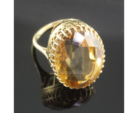 An 18ct gold and citrine set oval dress ring, size I.