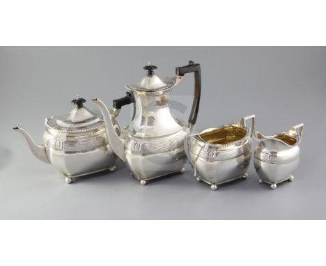 A late Victorian/Edwardian four piece silver tea and coffee service, by The Barnards, with engraved inscription, of oval form