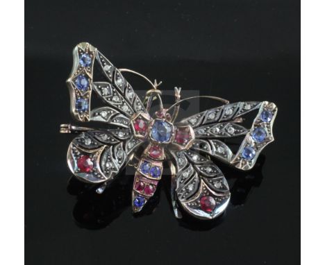 A Victorian gold and silver, sapphire, ruby and rose cut diamond set openwork butterfly brooch, 46mm.