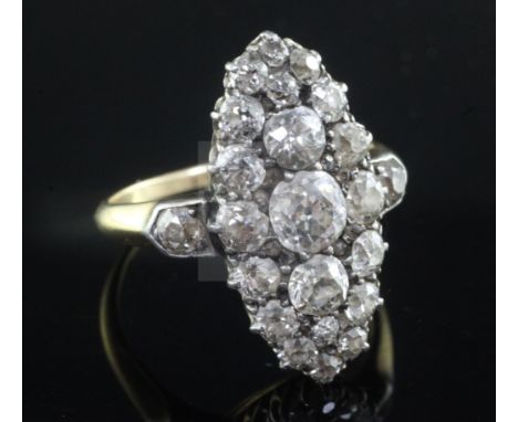 An early 20th century Georgian style gold and old cut diamond set oval dress ring, with diamond set shoulders, size P.