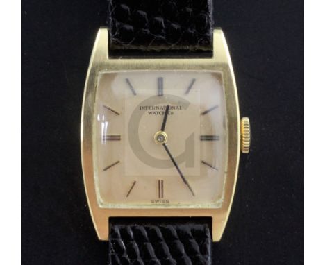 A lady's 18ct gold International Watch Co manual wind wrist watch, with tonneau shaped case and baton numerals, on associated